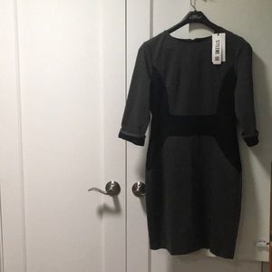 Fitted charcoal gray and black dress.